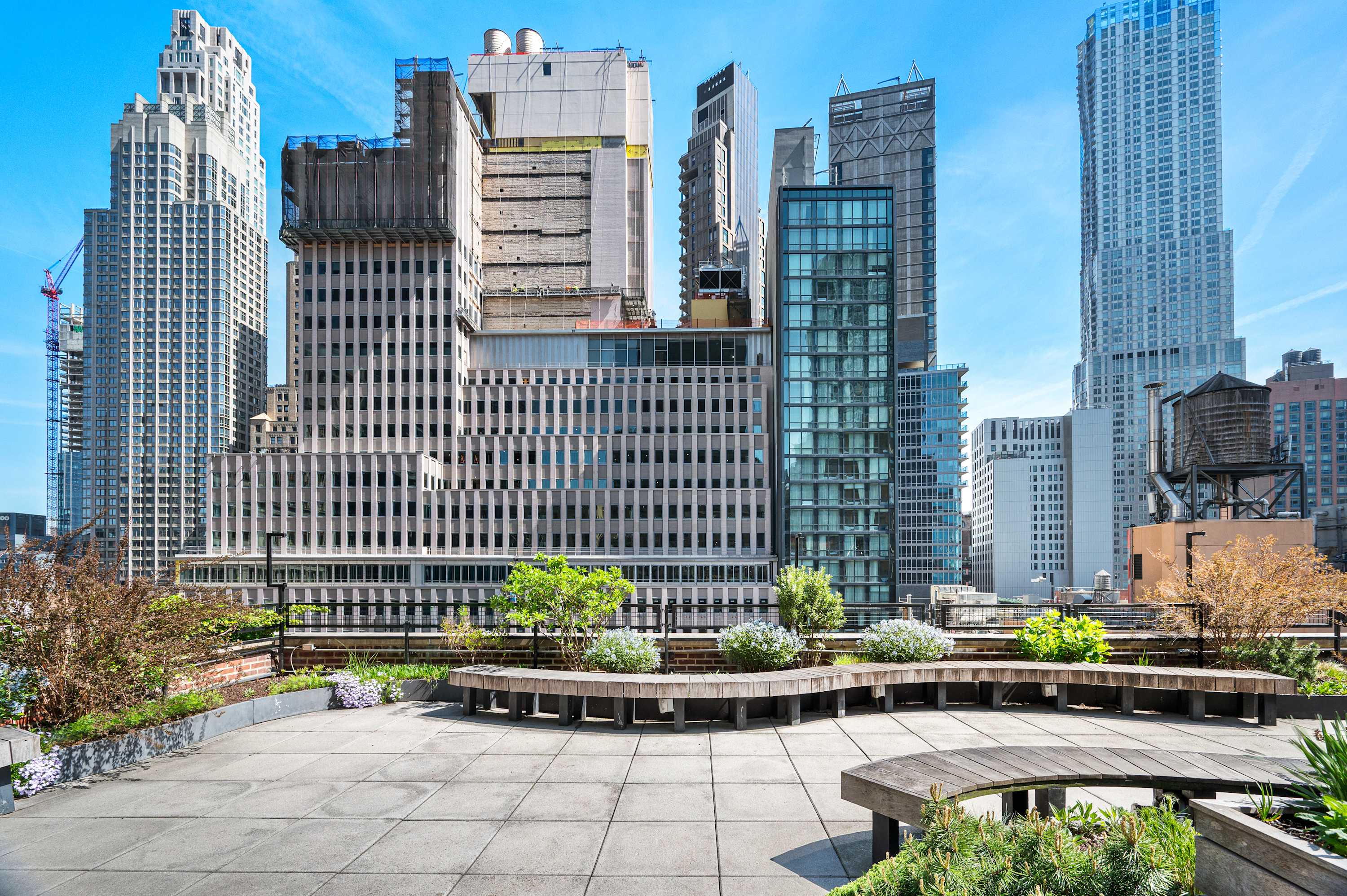 Aerial view over Lower Manhattan rooftops and towers near John Street.