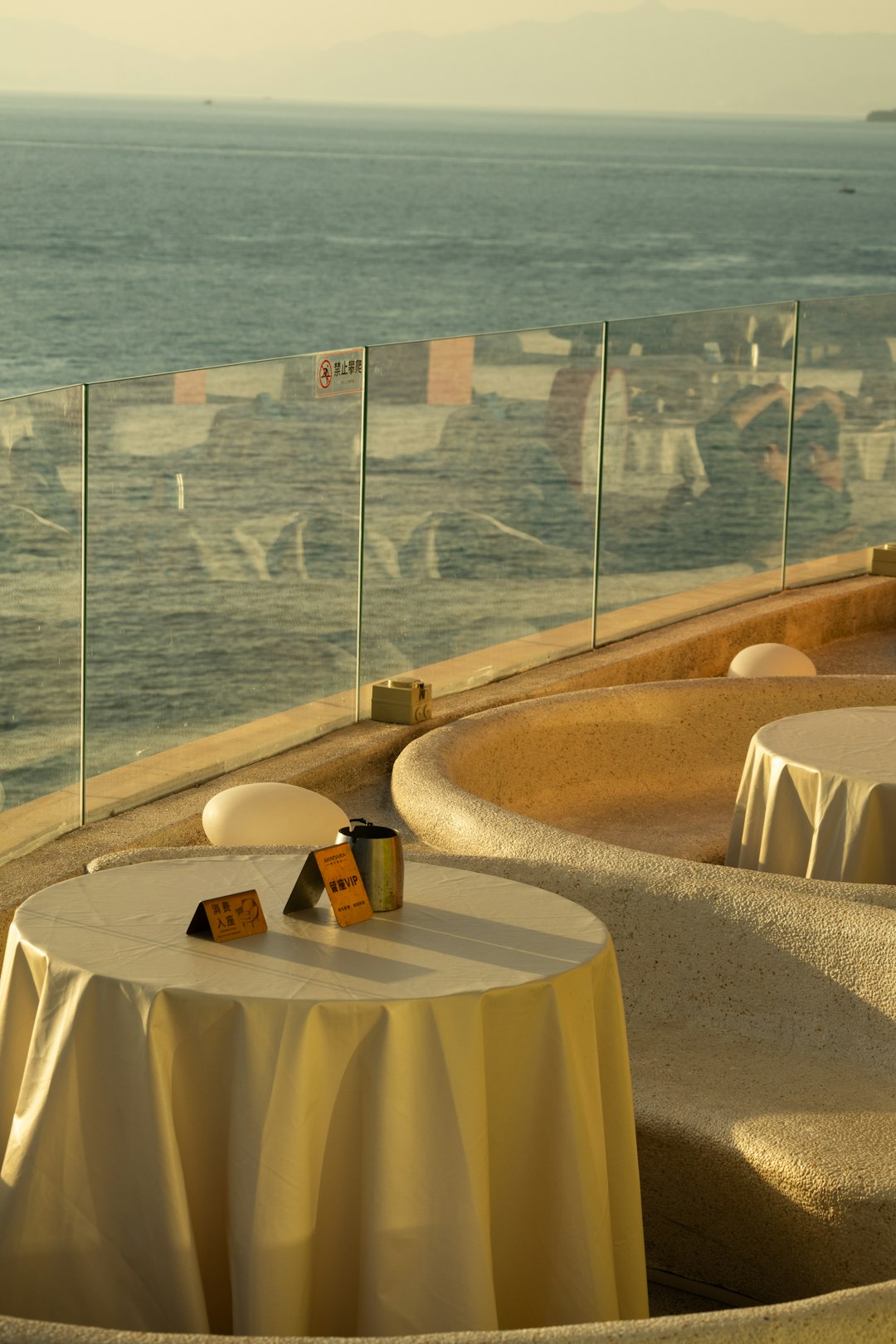 Our tables set for lunch by the ocean at golden hour