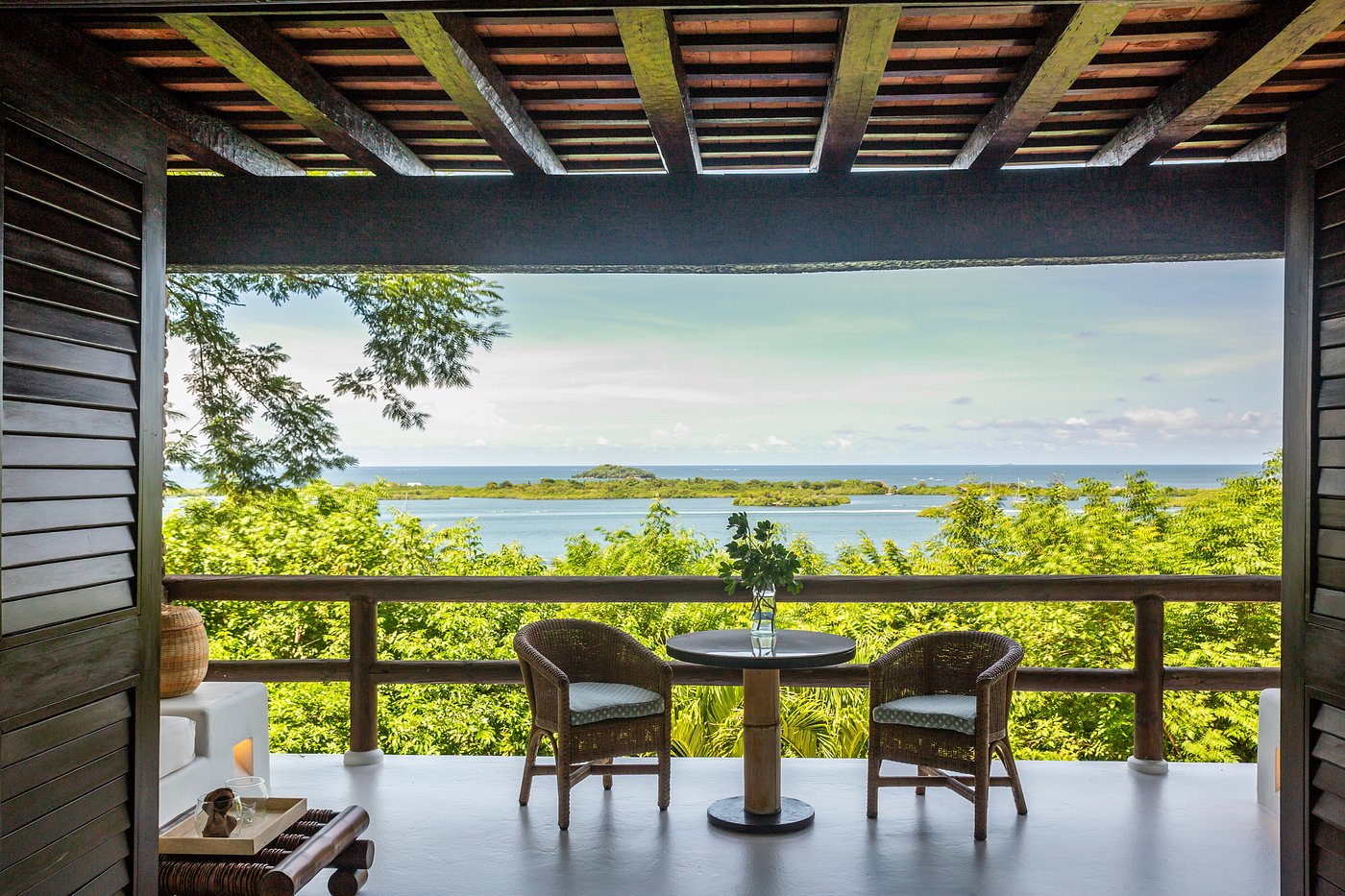 A balcony looking out over the water and trees on Barú Island