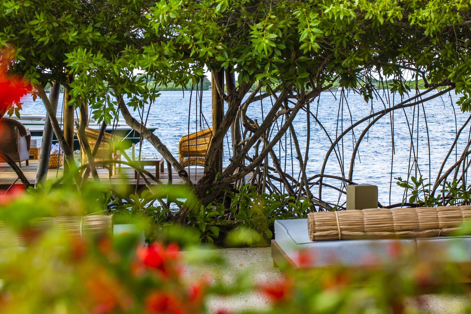 A shaded outdoor lounge looking out over the water at Bahía de Cholón, Barú Island.