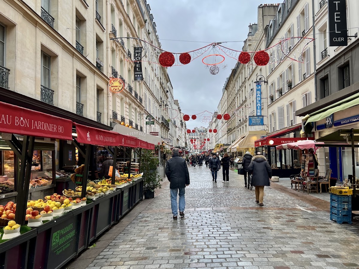 Rue Cler, a pedestrian shopping street in the 7th arrondissement, with its red awnings