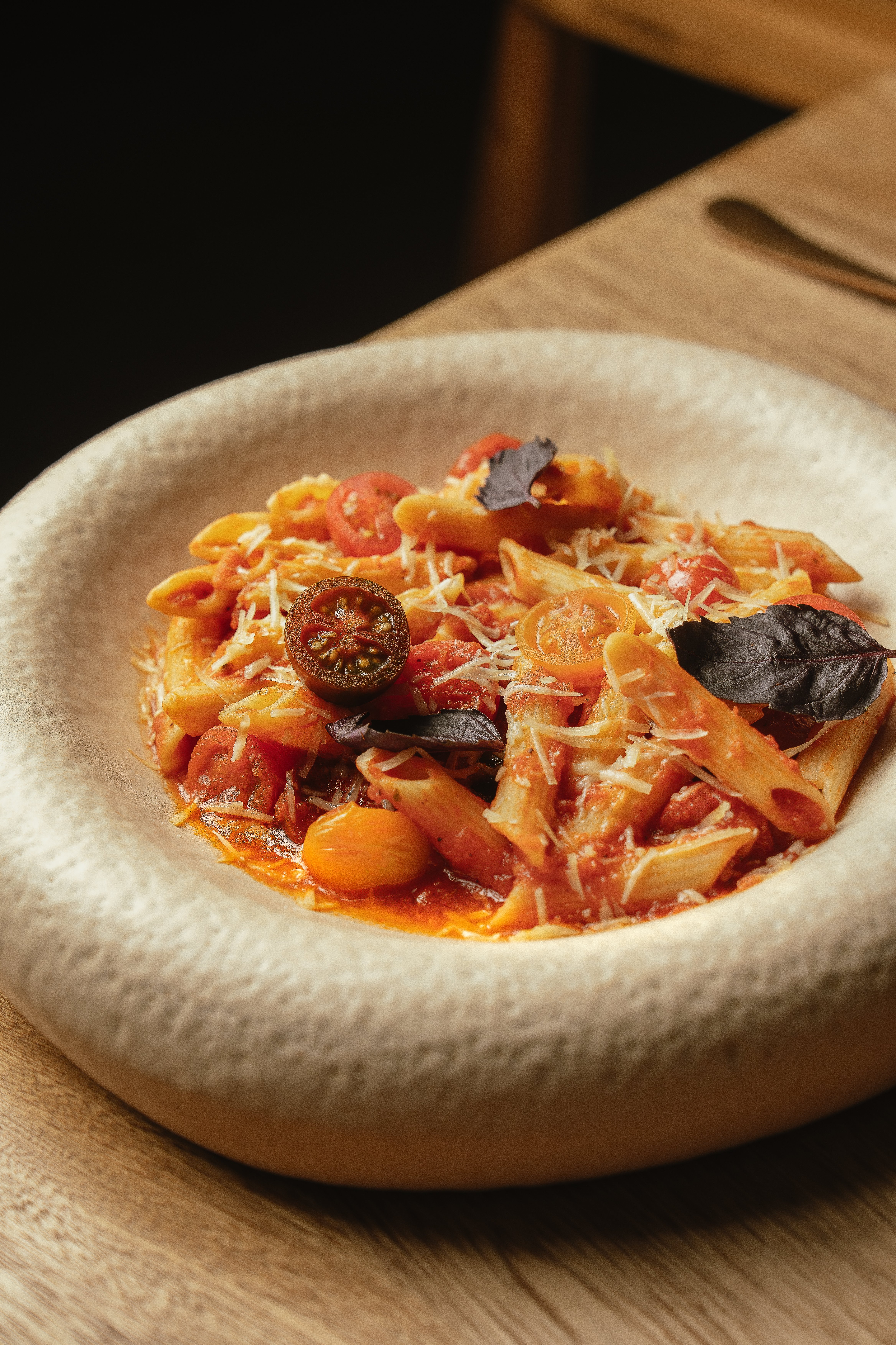 Handmade pasta in tomato sauce with basil at Climo