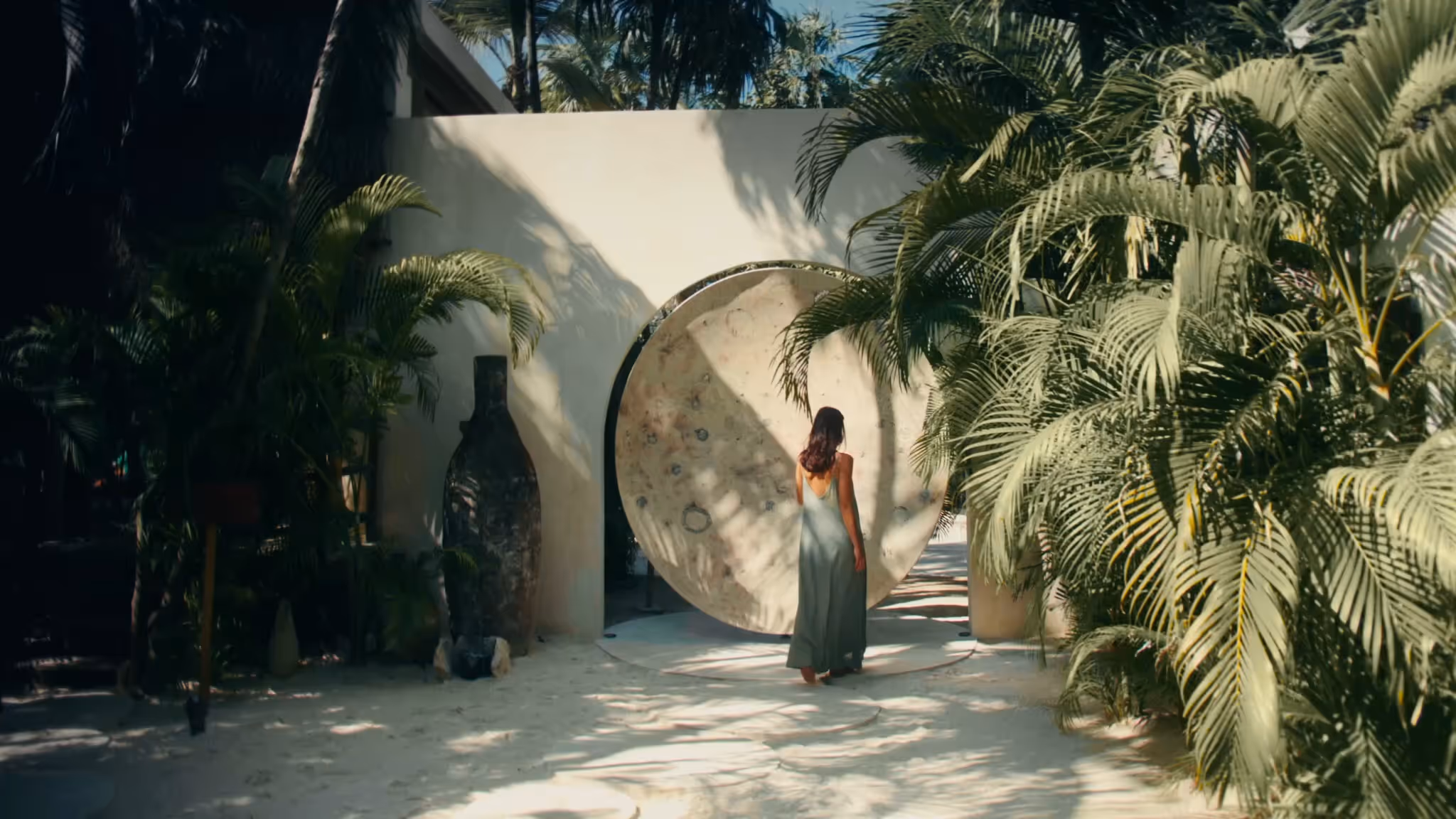 Aerial view of turquoise plunge pools among palms at La Valise Tulum