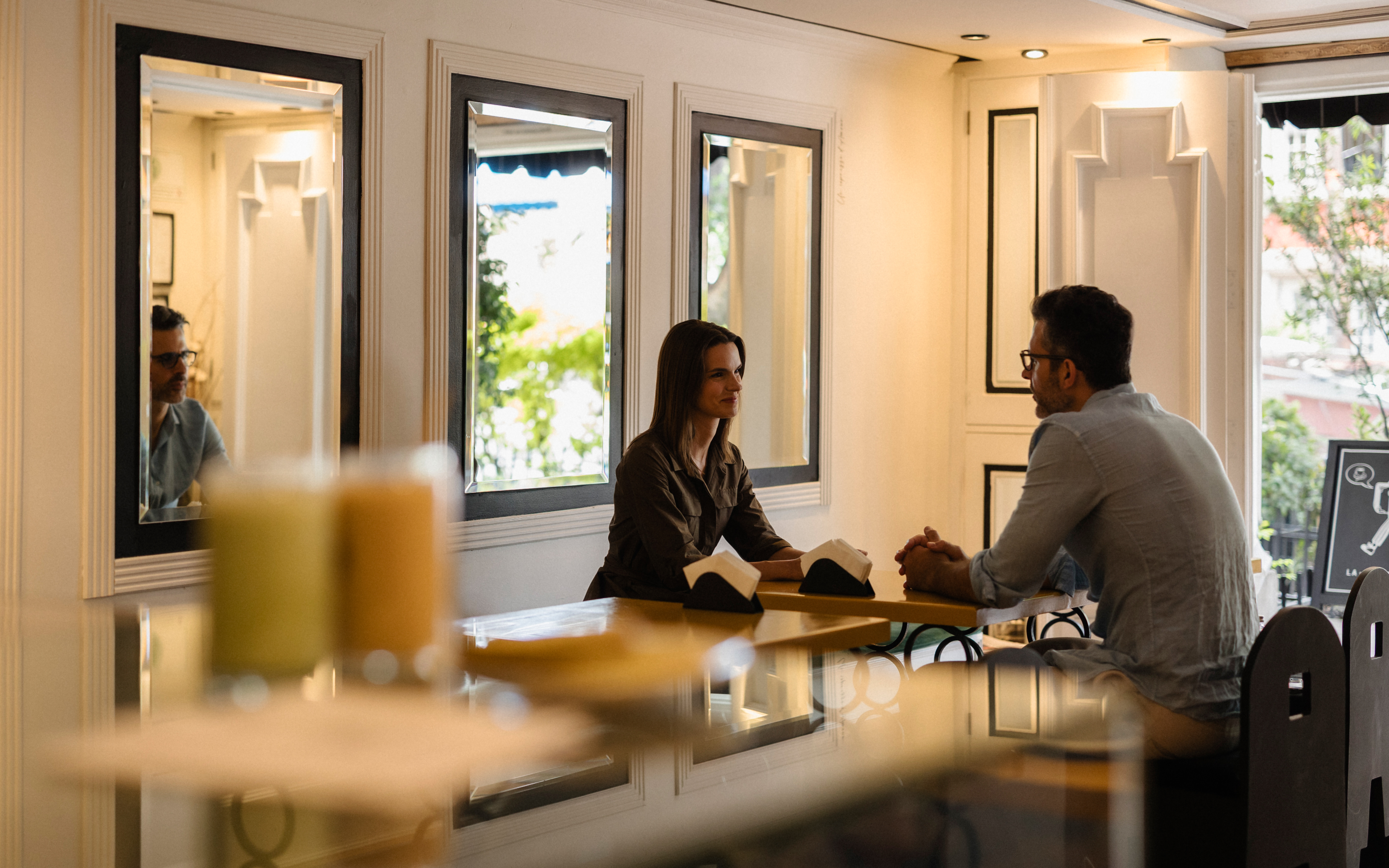 Coffee and fresh juice at a window table inside La Valise Café